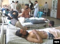 Afghans injured in a coalition air strike, one of the major causes of civilian casualties