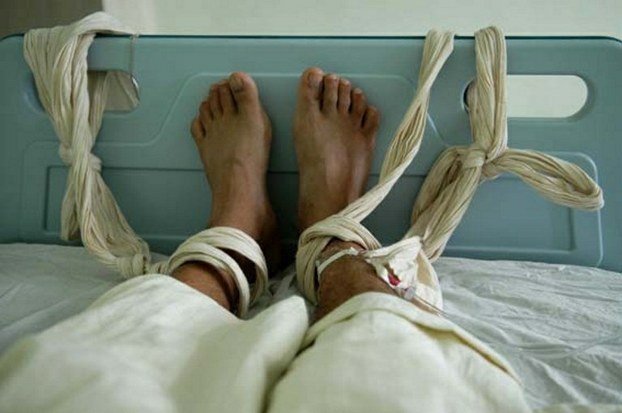 A file photo of a patient at a psychiatric hospital in Fuzhou receiving a blood transfusion with bound feet.