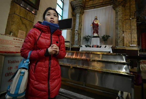 A Chinese Catholic leaves after mass at the Cathedral of the Immaculate Conception in Beijing on Feb. 20, 2013.