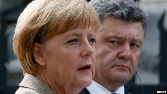 Germany's Chancellor Angela Merkel speaks during a news conference with Ukraine's President Petro Poroshenko in Kyiv.