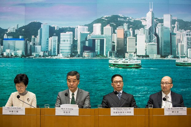 Hong Kong Chief Secretary for Administration Carrie Lam, Hong Kong Chief Executive Leung Chun-ying, Secretary for Justice Rimsky Yuen and Secretary for Constitutional and Mainland Affairs Raymond Tam meet the press following a ruling by Beijing on two elected pro-independence lawmakers from the city's legislature, Nov. 7, 2016.