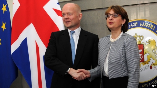 Georgian Foreign Minister Maia Panjikidze (right) with her British counterpart William Hague in Tbilisi on May 8. 