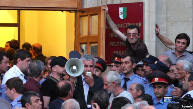 Demonstrators storm the building where the president's office is located in Sukhumi on May 27.