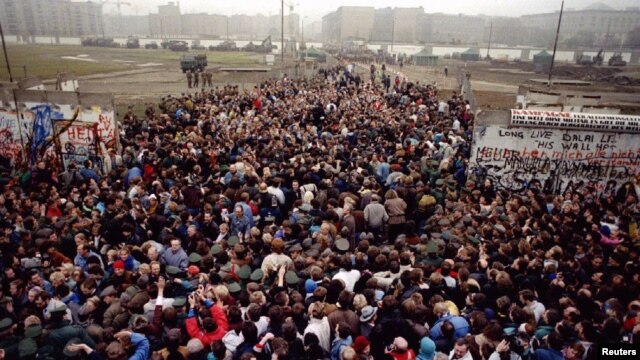 East Berliners and West Berliners after the fall of the Berlin Wall in 1989. Now, some Russian parliamentary deputies want to condemn the subsequenb reunification of Germany as an 'annexation.'