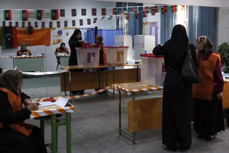 A woman votes at a polling station inside a school in Tripoli, Libya, June 25, 2014.