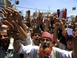 Antigovernment protesters shout slogans during a rally to demand the ouster of Yemen's President Ali Abdullah Saleh in Sanaa in late September.