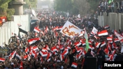 Supporters of Iraqi Shi'ite cleric Muqtada al-Sadr shout slogans during an anti-Turkey protest in front of the Turkish Embassy in Baghdad on October 18.