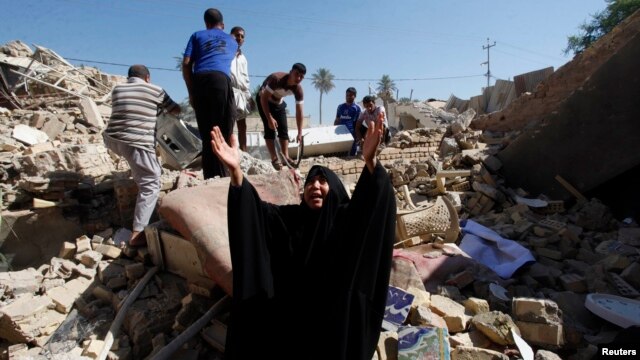 A woman reacts at the site of a suicide bomb attack on Shi'ite mosque in Mussayab, south of Baghdad, on September 30.