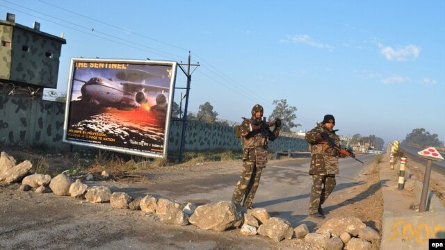 Indian security personnel stand outside the air base in Pathankot, Punjab, on January 5.