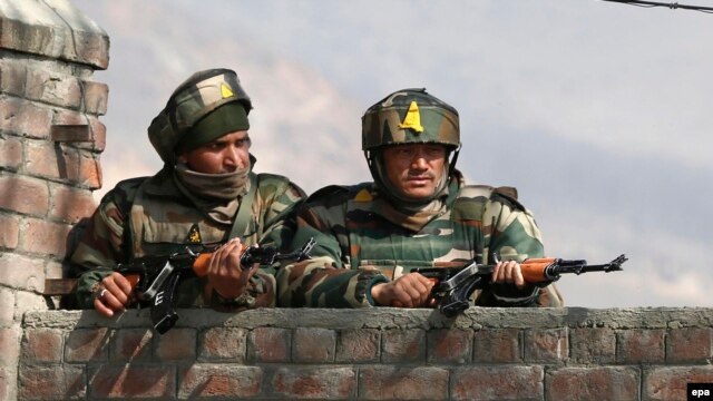 Indian soldiers take position during fighting earlier this year against Pakistani militants in Kashmir.