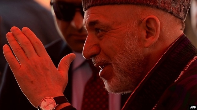 Afghan President Hamid Karzai at a charitable housing project event in Kabul on May 16