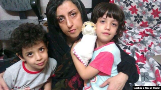 Iranian human rights activist, Narges Mohammadi with her children Ali (center) and Kiana
