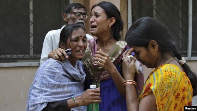 Women outside a mortuary in the southern Indian city of Hyderabad mourn the death of a relative who was killed in one of the February 21 explosions.