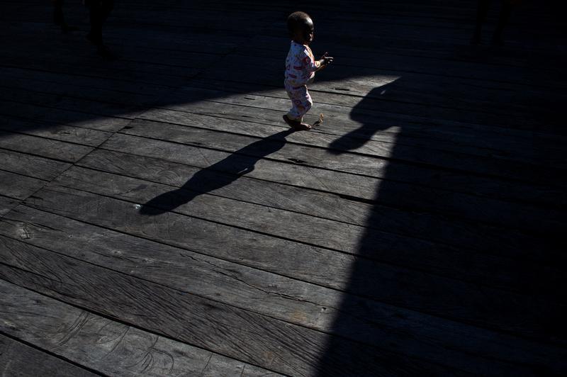 A sick child walks after getting medical treatment at Agats village in Asmat district, after the government dispatched military and medical personnel to the remote region of Papua to combat malnutrition and measles, Indonesia, January 22, 2018.