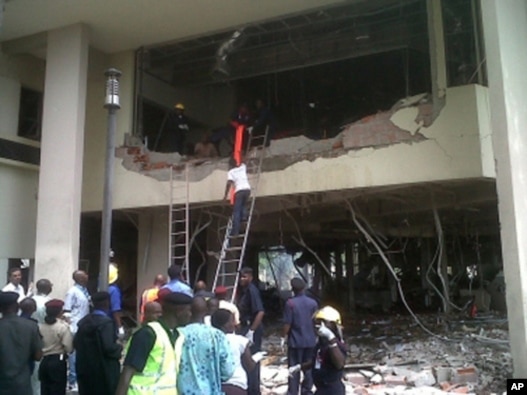 Firefighters and rescue workers hunt for survivors at the UN's Abuja office.