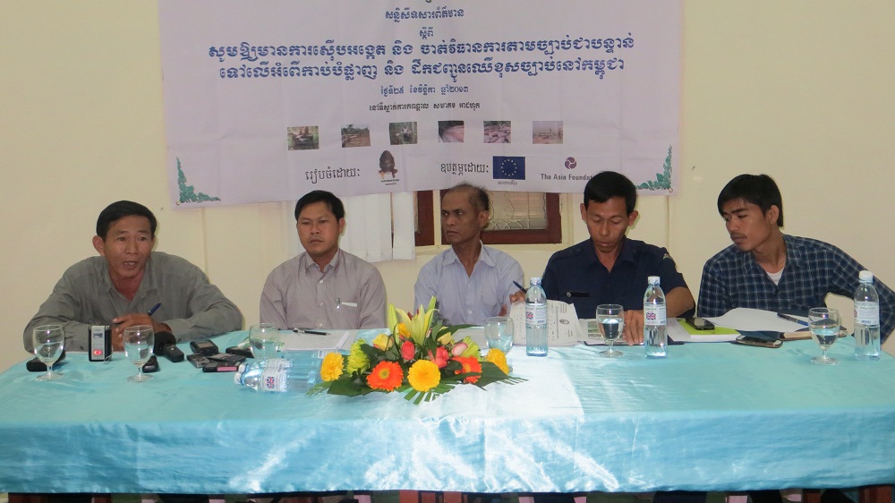 Representatives from five Cambodian NGOs speak at a press conference to demand government action against illegal logging, Nov. 25, 2013.