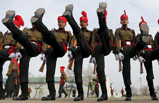 Indian Army recruits in ceremonial uniform graduate from a 49-week training program in Rangreth, Jammu and Kashmir, March 5, 2016. Journalist Poonam Argawal faces charges for an undercover investigative report alleging senior officers near Mumbai improperly ordered subordinates to carry out personal errands on their behalf. 