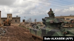 Ankara says Turkish troops and allied Syrian rebels have captured 