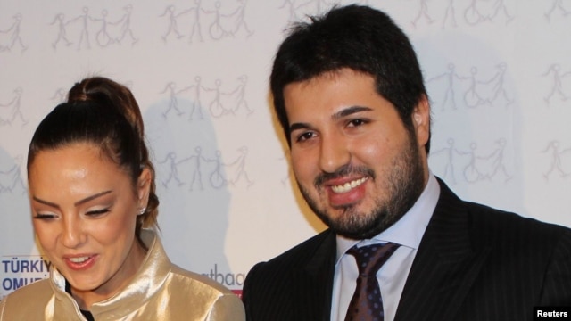Turkish singer Ebru Gundes (left) stands with her husband, Reza Zarrab, who is in jail awaiting trial on charges of helping Iran evade U.S. sanctions.