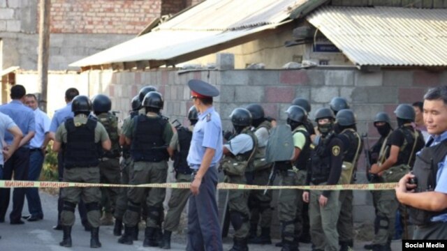 Kyrgyz security forces at the site of the shoot-out in Bishkek that killed four