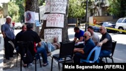 Railway employees protest outside the offices of the Georgian Railway in Tbilisi on August 21.