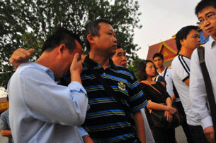 Family members of the sailors killed on the Mekong River grieve in Yunnan province, Oct. 13, 2011.