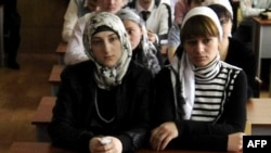 Headscarf-wearing female students attend classes at the Grozny State Oil Institute in Chechnya.
