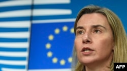 EU foreign-policy chief Federica Mogherini delivers a press briefing at an EU-Ukraine Association Council at the EU headquarters in Brussels on December 19.
