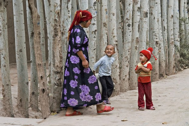 A Uyghur woman is shown with her children in Kashgar, Xinjiang, in a file photo.
