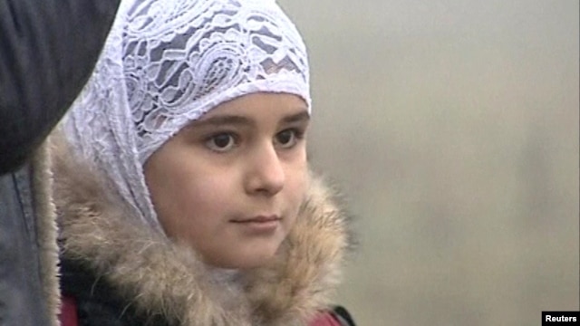 A young girl wear Islamic-style head scarf in Stavropol, in sourthern Russia.