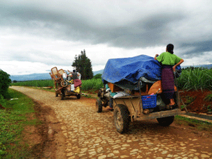 Kachin refugees flee to Burma's border with China to escape the fighting, June 14, 2011.