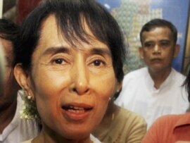 Aung San Suu Kyi speaks to reporters at her National League for Democracy Party headquarters, 29Jun2011