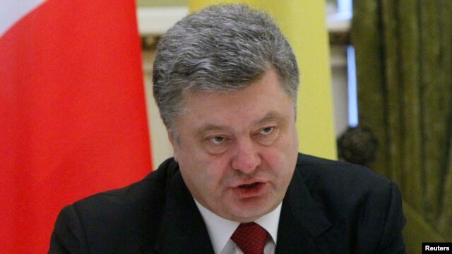 Ukrainian President Petro Poroshenko says pro-Russian separatists have withdrawn a 'significant amount' of heavy weapons as well.