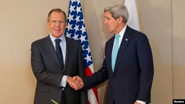 U.S. Secretary of State John Kerry (right) shook hands with Russian Foreign Minister Sergei Lavrov in Geneva on March 2, but neither made any public remarks before they began talks.