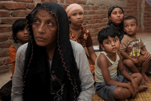 A Rohingya Muslim family seen in the Burmese-Bangladesh border after fleeing violence in Burma's Rakhine state, June 12, 2012.