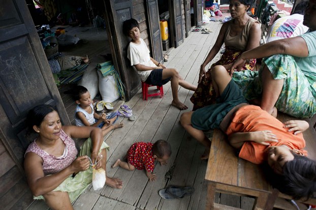 Flood-affected residents rest at an evacuation camp in Kalay, northwest Myanmar's Sagaing region, Aug. 3, 2015.