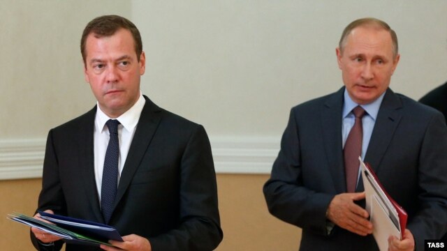 Russian President Vladimir Putin (right) and Prime Minister Dmitry Medvedev arrive at a Security Council session held in Sevastopol, Crimea, on August 19.