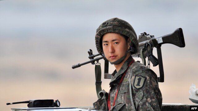 A South Korean soldier stands on guard near the demilitarized zone dividing the two Koreas on April 5.