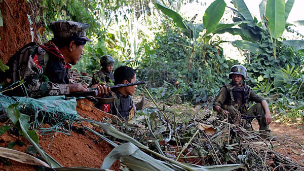 Soldiers from the Kachin Independence Army's 3rd Brigade secure an area on Hka Ya mountain in northern Myanmar's Kachin state in a file photo.