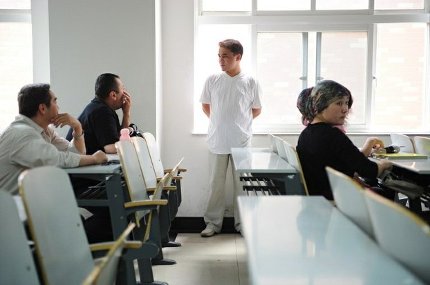 Ilham Tohti chats with students on June 12, 2010 after a lecture at the Central University for Nationalities in Beijing.