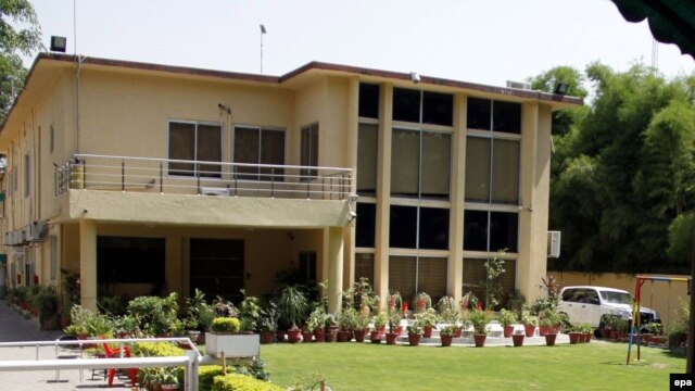 An exterior view of the sealed offices of the international charity Save The Children in Islamabad on June 12