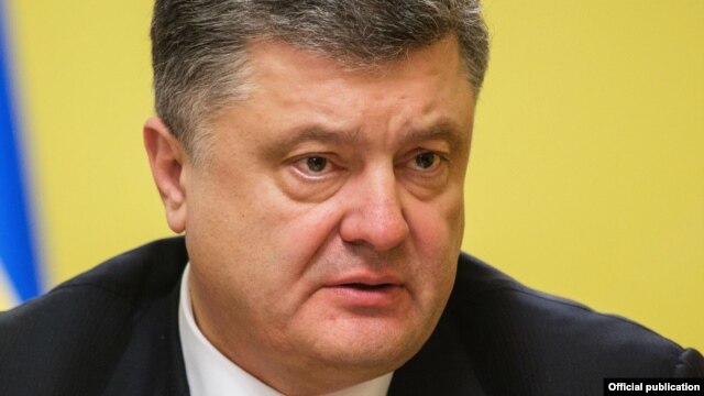 Ukrainian President Petro Poroshenko has signed into law legislation granting special status to areas of eastern Ukraine under rebel control.