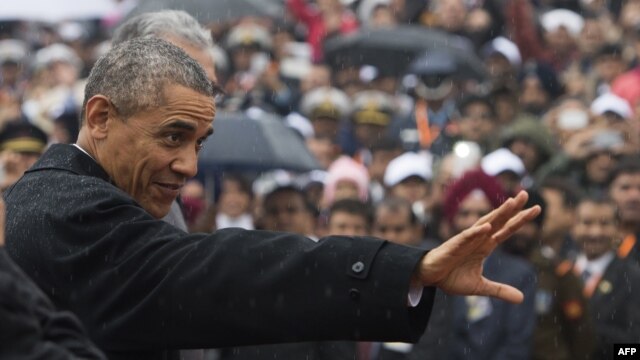 U.S. President Barack Obama waves as he arrives to attend India's Republic Day Parade in New Delhi.