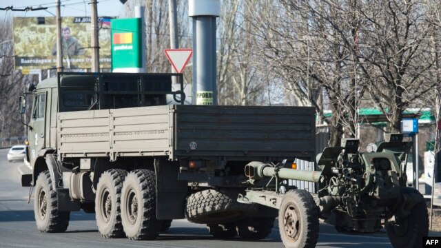 An artillery gun of the self-proclaimed 'People's Republic of Donetsk' is towed in Donetsk in March.
