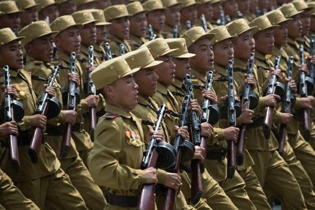 North Korean soldiers march in a military parade through Kim Il Sung square in Pyongyang marking the anniversary of the Korean War armistice, July 27, 2013.