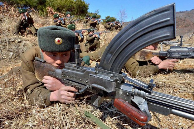 This picture, taken by the Korean Central News Agency on March 20, 2013, shows Korean People's Army soldiers at an undisclosed location in North Korea.