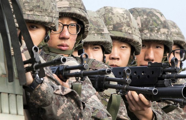 South Korean soldiers ride a military truck on the road leading to the truce village of Panmunjom in the border city of Paju, August 24, 2015