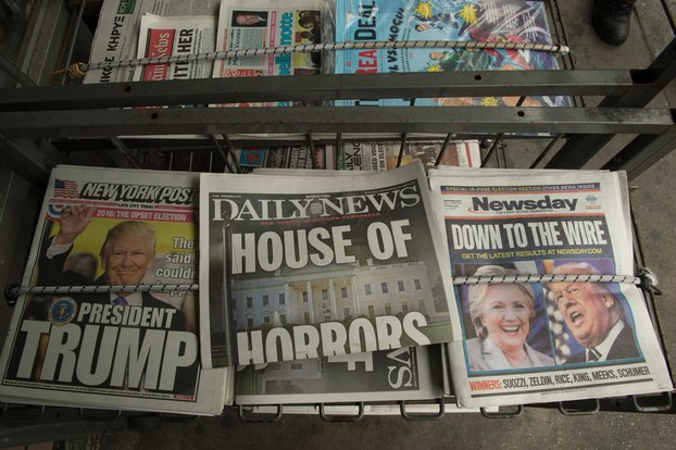 Newspapers for sale in New York following Donald Trump's defeat of Hillary Clinton to take the U.S. presidency, Nov. 9, 201