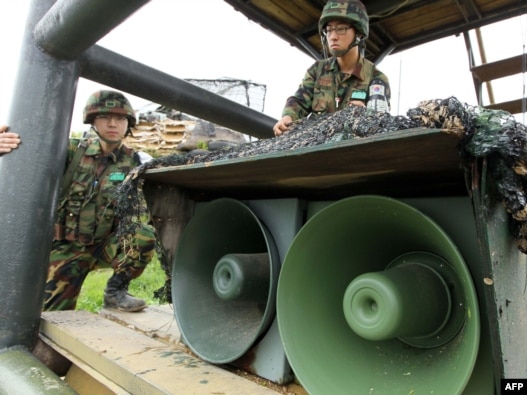 South Korean soldiers stand by loudspeakers at a guard post near the demilitarized zone separating the two Koreas in Yanggu on May 24.