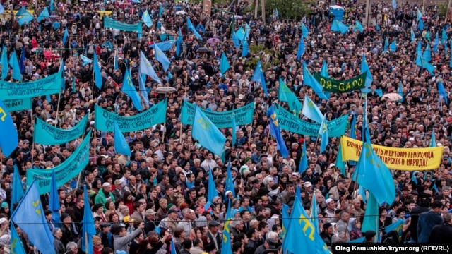 Crimean Tatars mourn those killed in the deportation at a rally on May 18 in Simferopol.